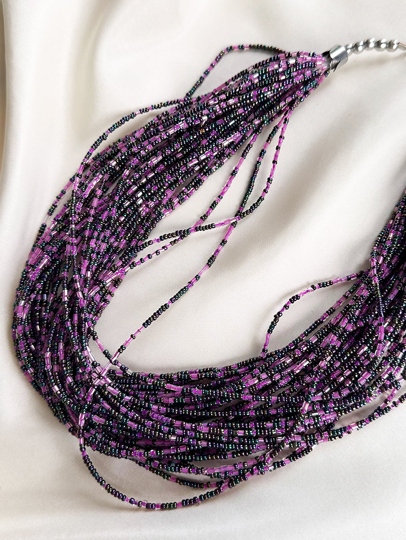 Gelaagde ketting met kleine glaskraaltjes