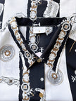Blouse met bladmuziek en muziekinstrumenten
