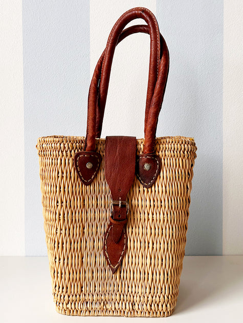 Rieten handtas met leren details