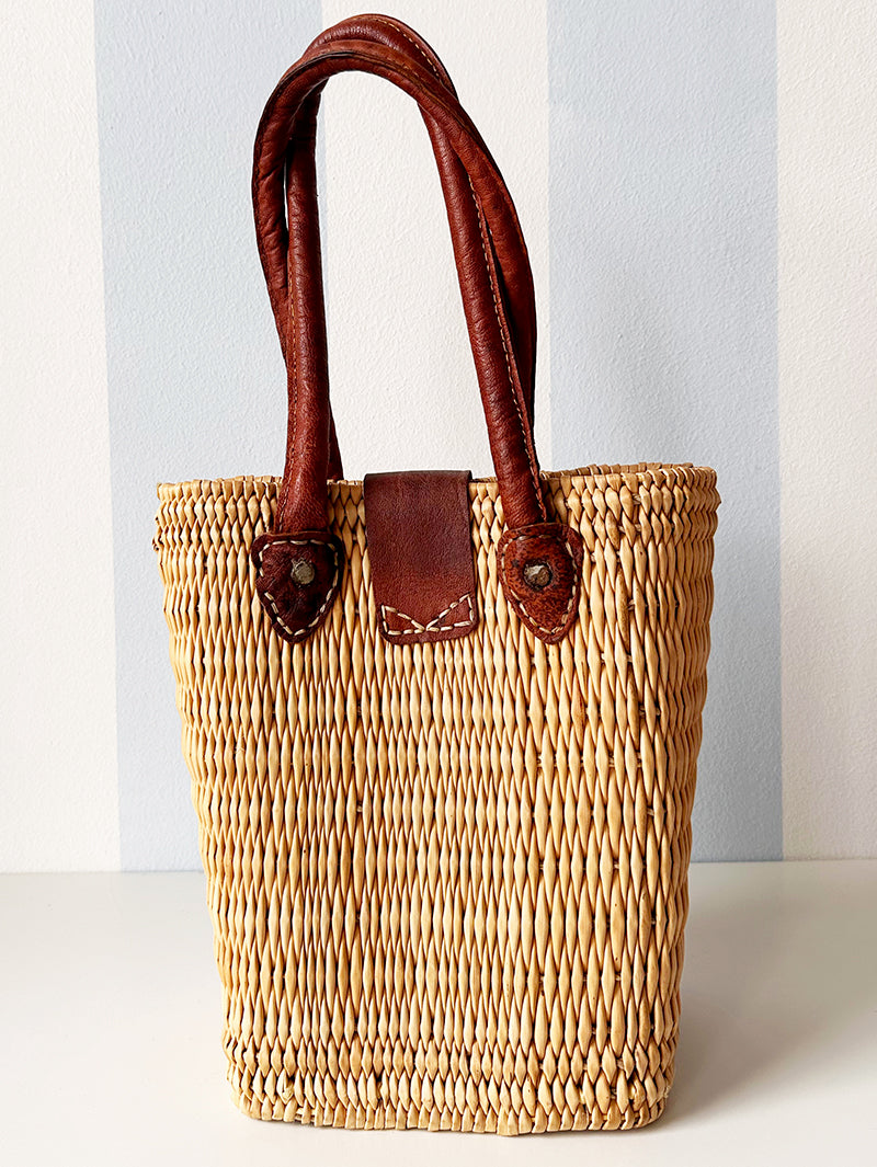 Rieten handtas met leren details