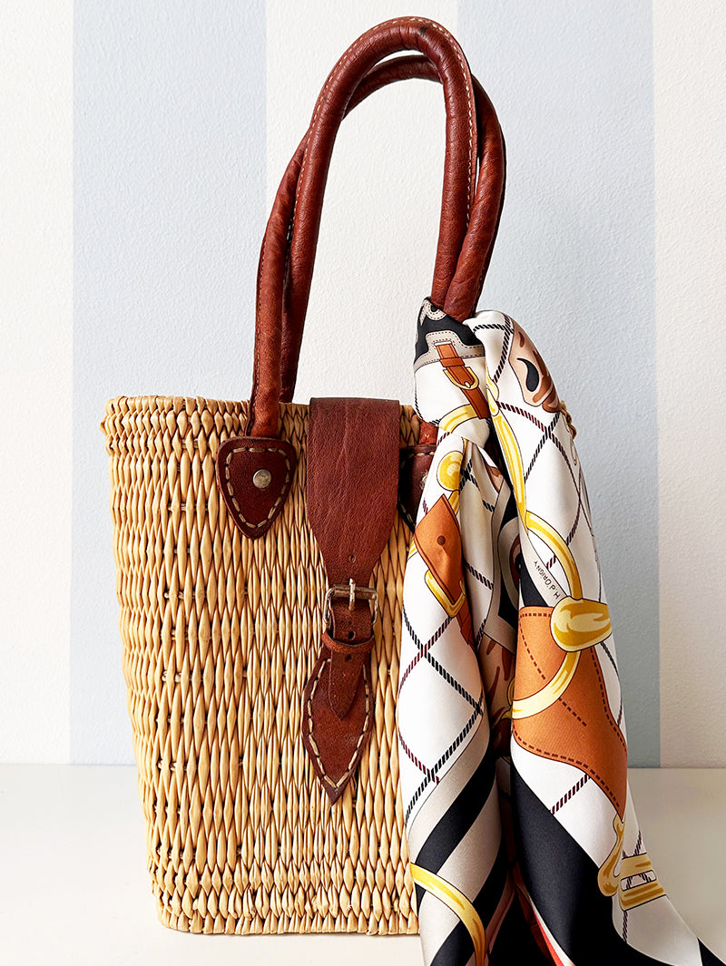 Rieten handtas met leren details