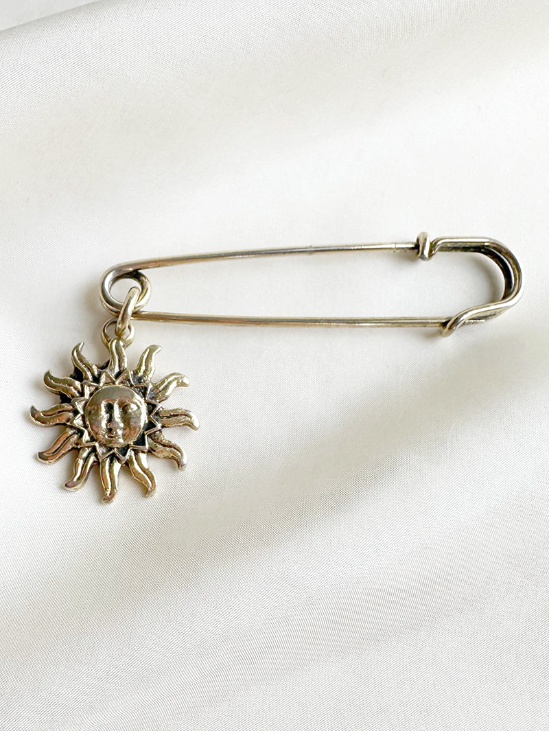 Gouden speld met zon