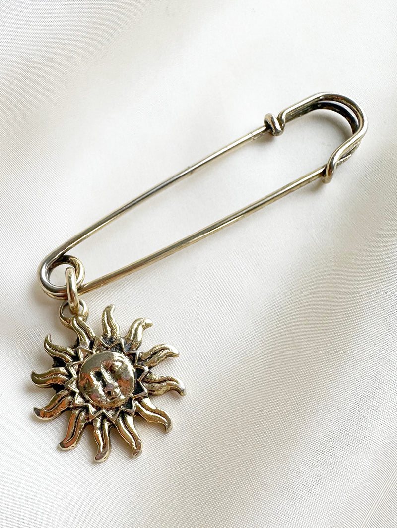 Gouden speld met zon