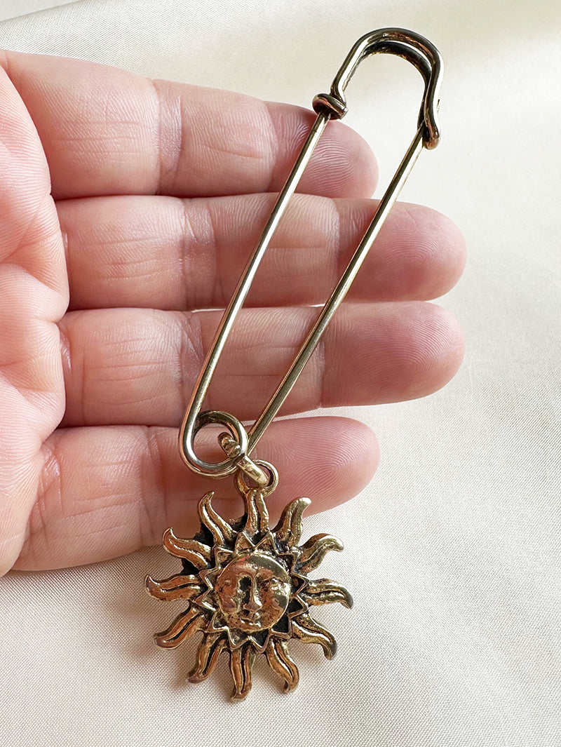 Gouden speld met zon
