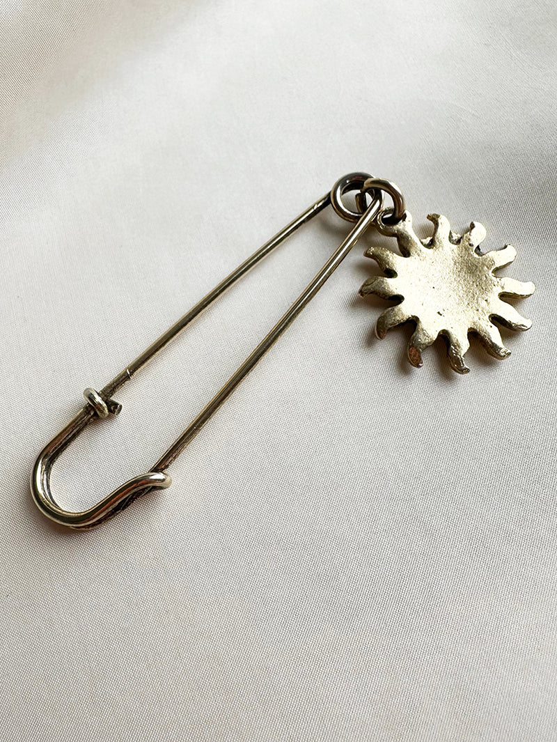 Gouden speld met zon