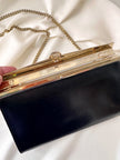 Zwart schoudertasje met gouden details