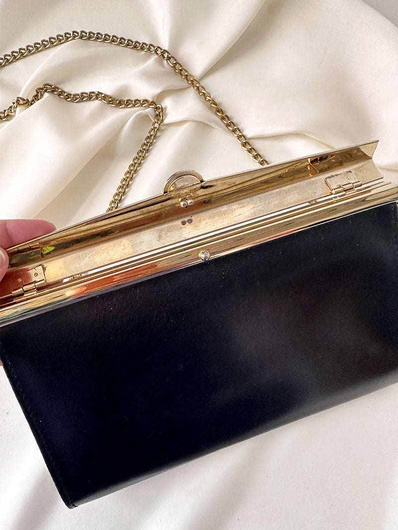 Zwart schoudertasje met gouden details