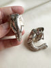 Verzilverde olifant clip oorbellen