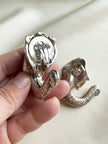 Verzilverde olifant clip oorbellen