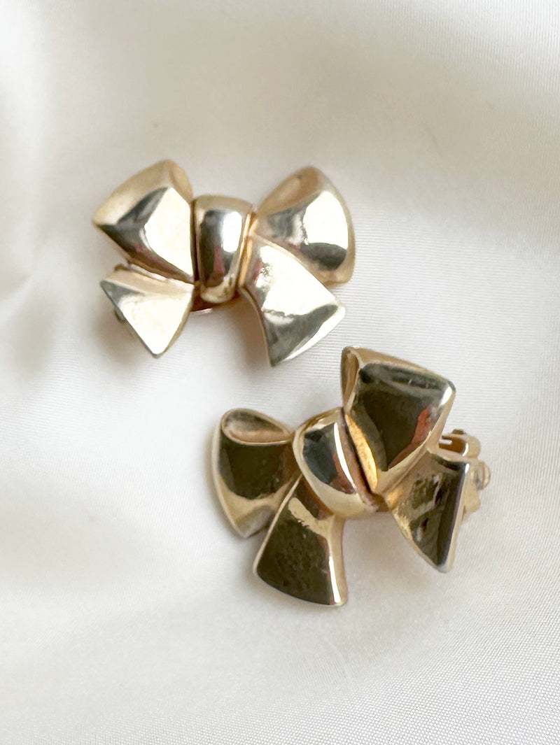 Gouden strikjes designer clip oorbellen