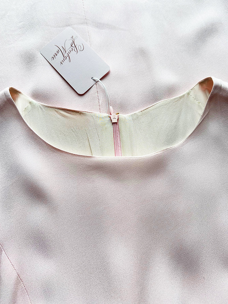 Lichtroze jurk met strik