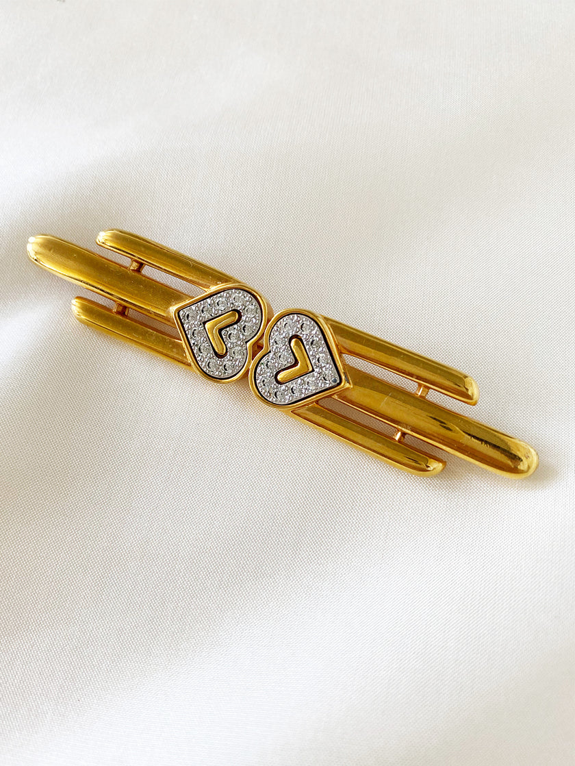 Vergulde designer broche