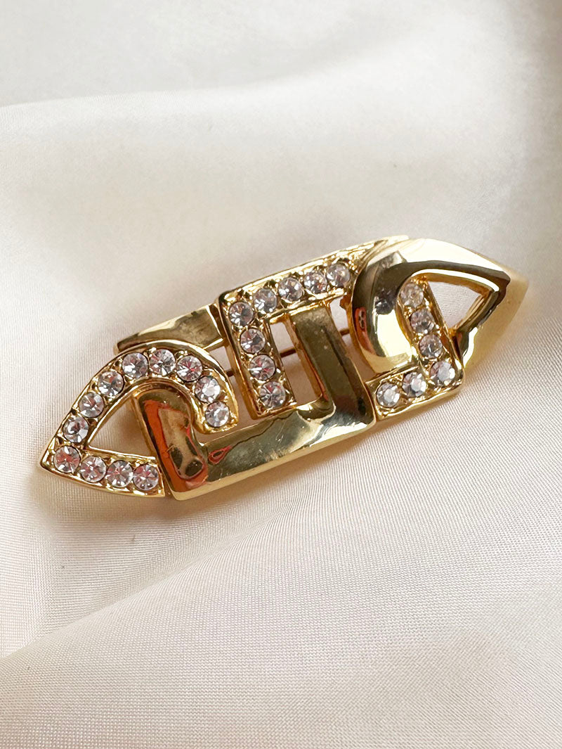 Vergulde broche met strass
