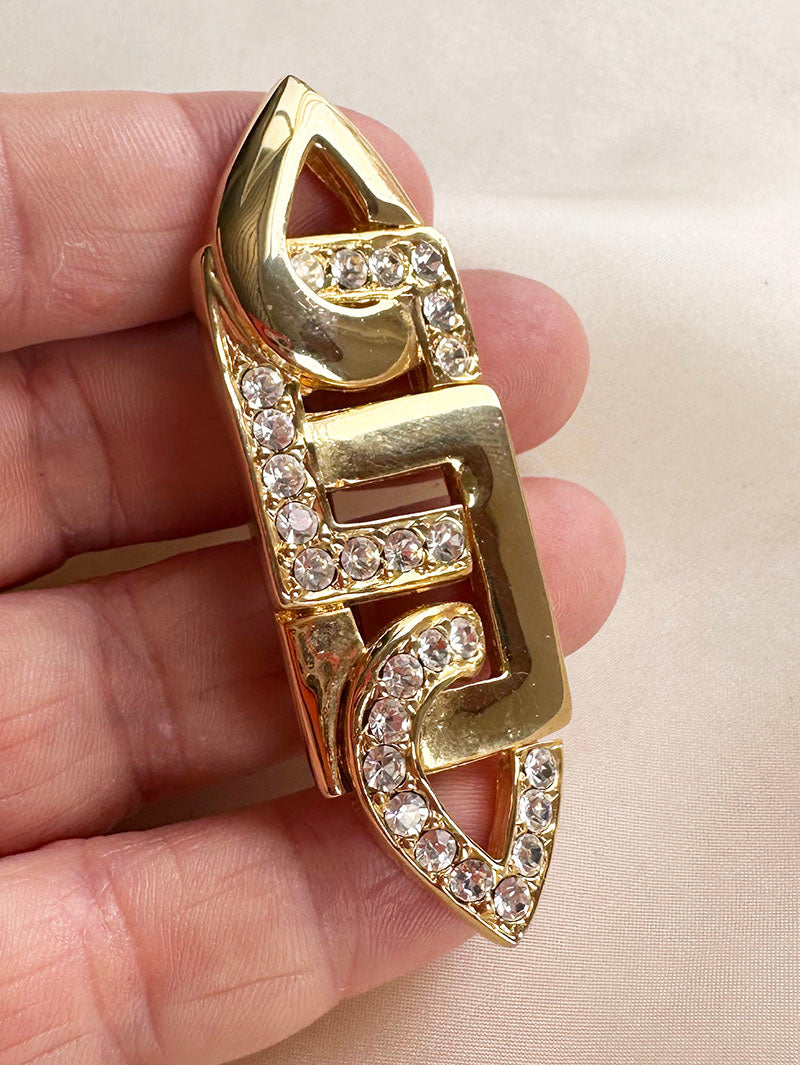 Vergulde broche met strass