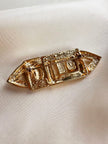 Vergulde broche met strass