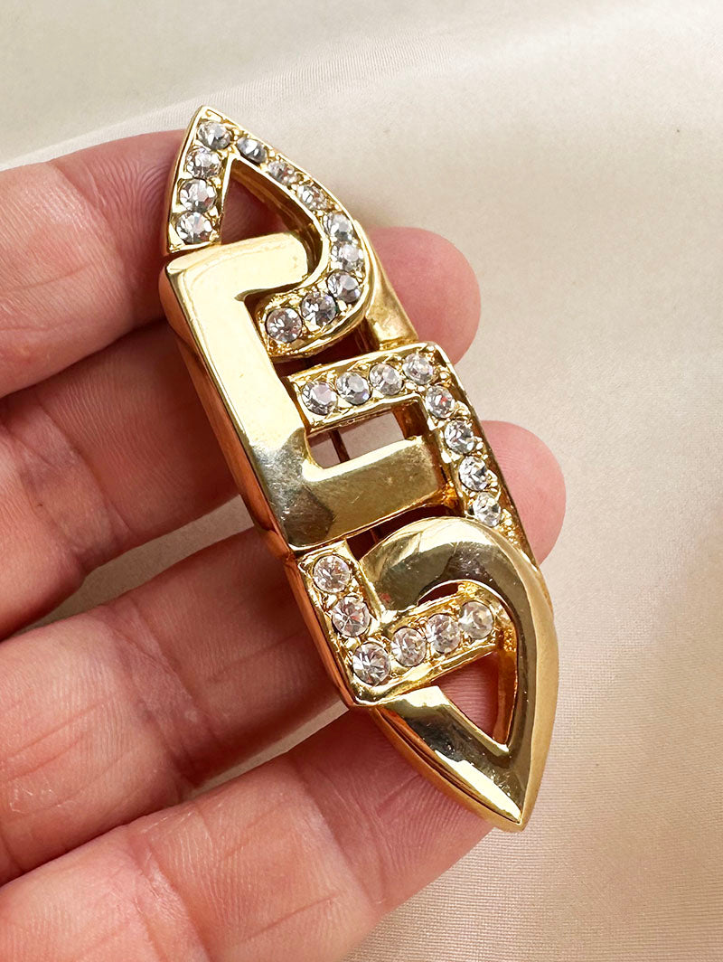 Vergulde broche met strass