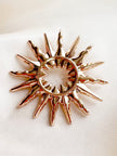 Gouden sunburst broche