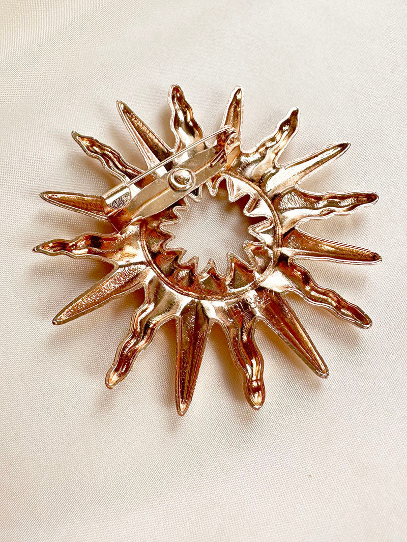 Gouden sunburst broche