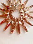 Gouden sunburst broche