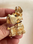 Matgouden hondje broche