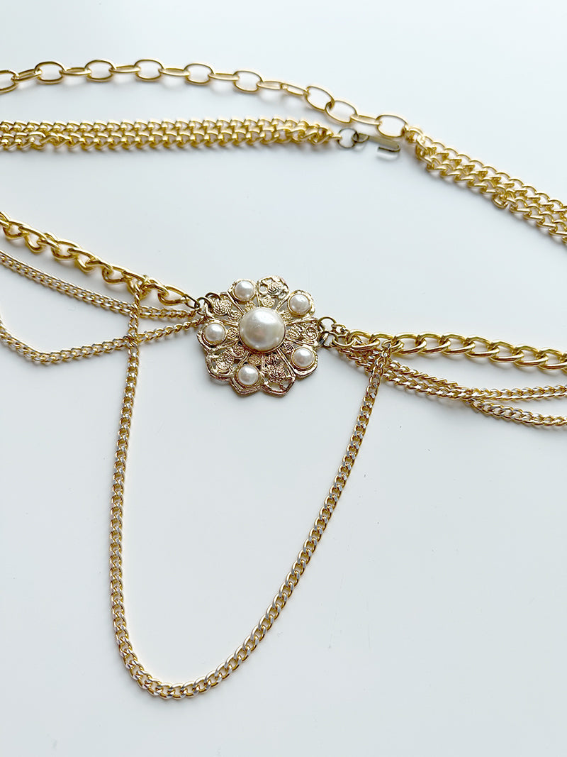 Gouden ceintuur met faux parels