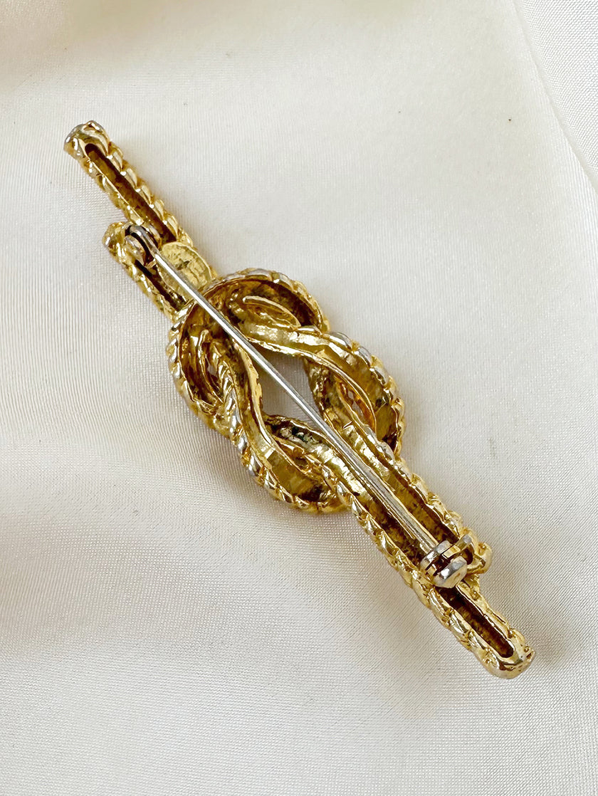 Gouden platte knoop broche