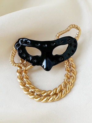 Zwart masker broche