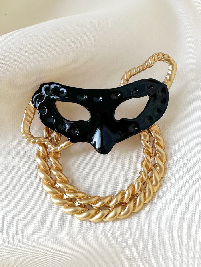 Zwart masker broche