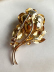 Grote gouden roos broche