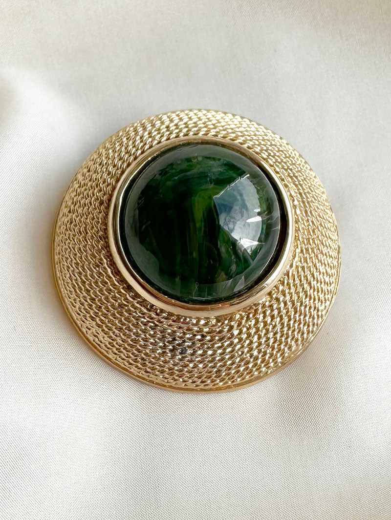 Grote broche met groene steen