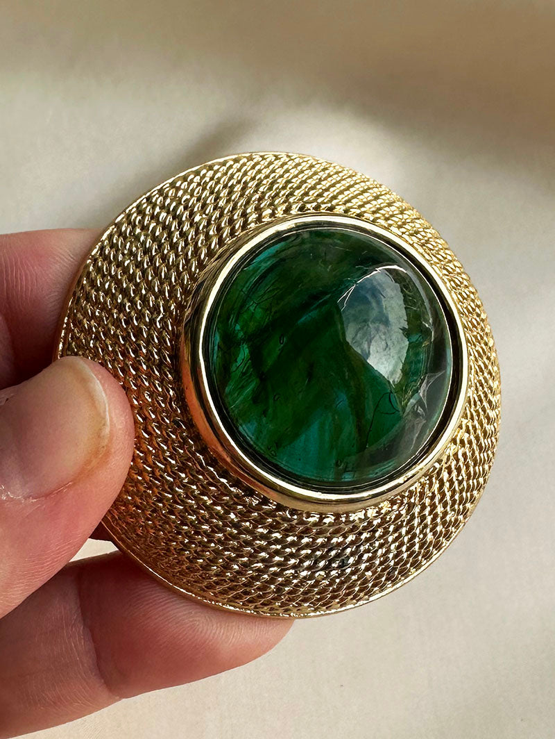 Grote broche met groene steen