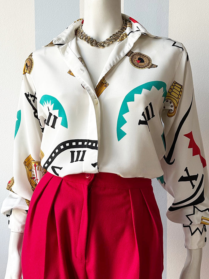 Designer blouse met klokken