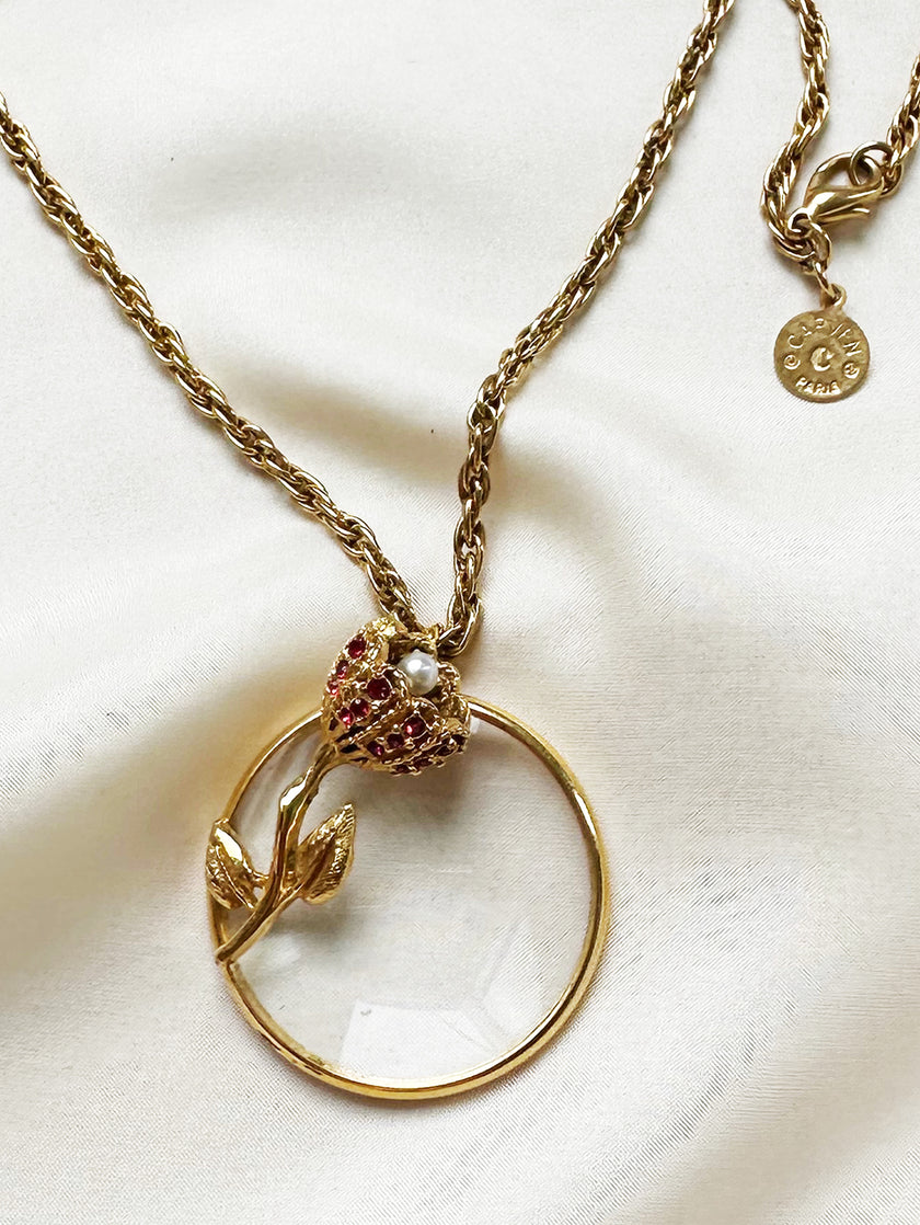 Vergulde designerketting met vergrootglas