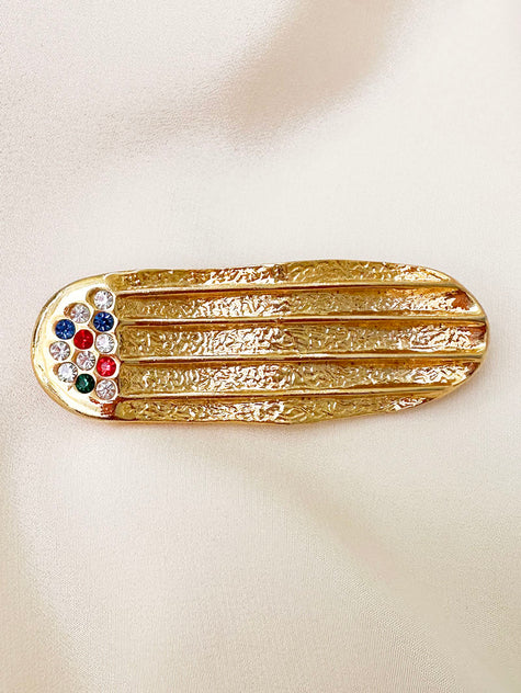 Vergulde ovale broche met strass