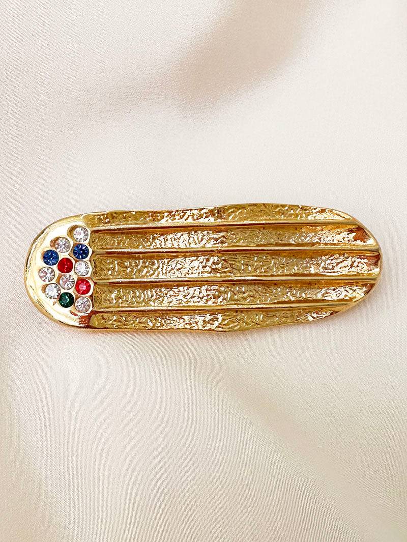 Vergulde ovale broche met strass