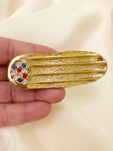 Vergulde ovale broche met strass