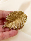 Groot gouden blad broche