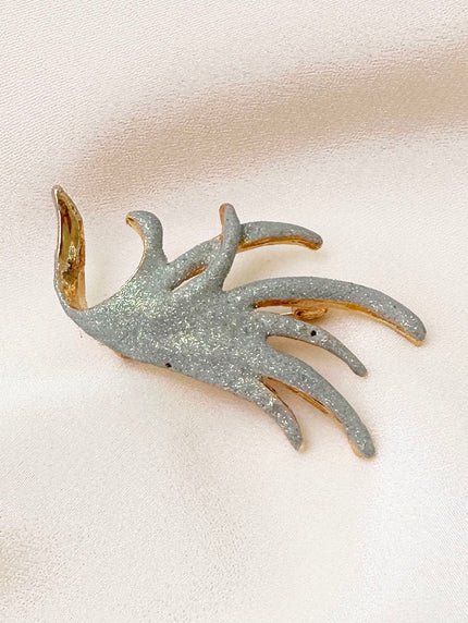 Vergulde glitter broche