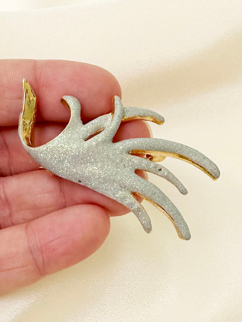 Vergulde glitter broche