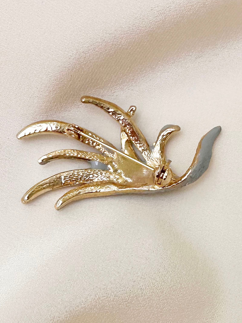 Vergulde glitter broche