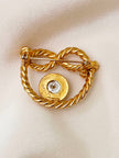 Vergulde broche met faux parel