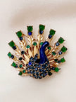 Designer pauw broche