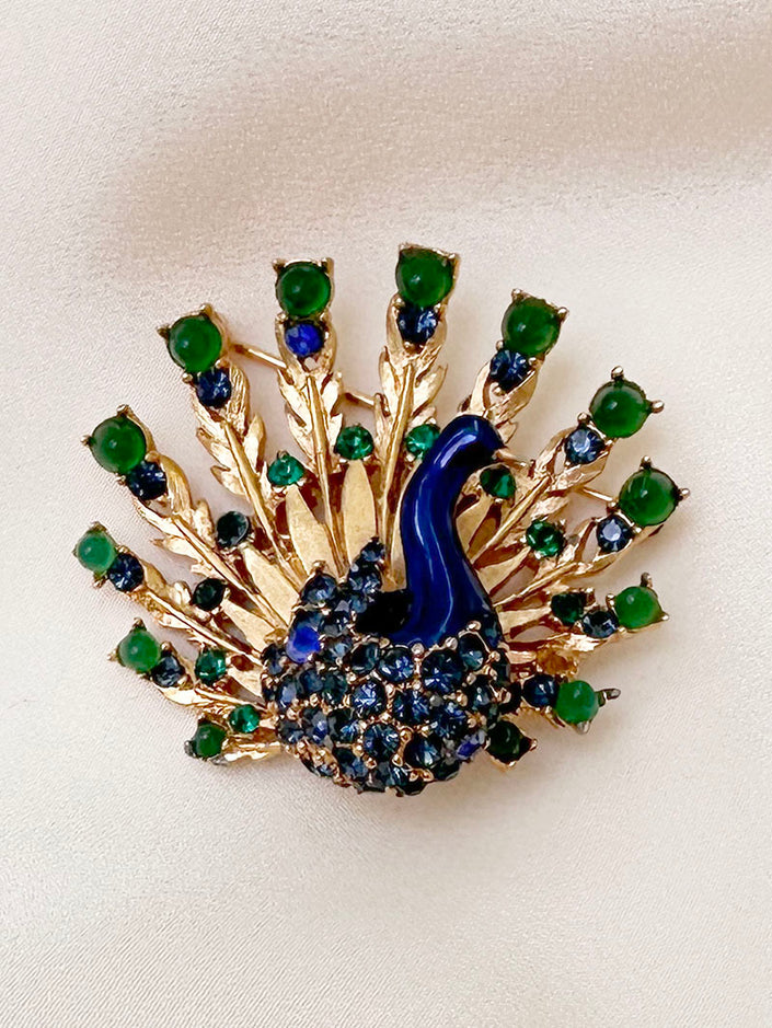 Designer pauw broche