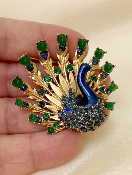 Designer pauw broche
