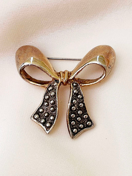 Goud/zilveren strik broche
