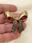 Goud/zilveren strik broche