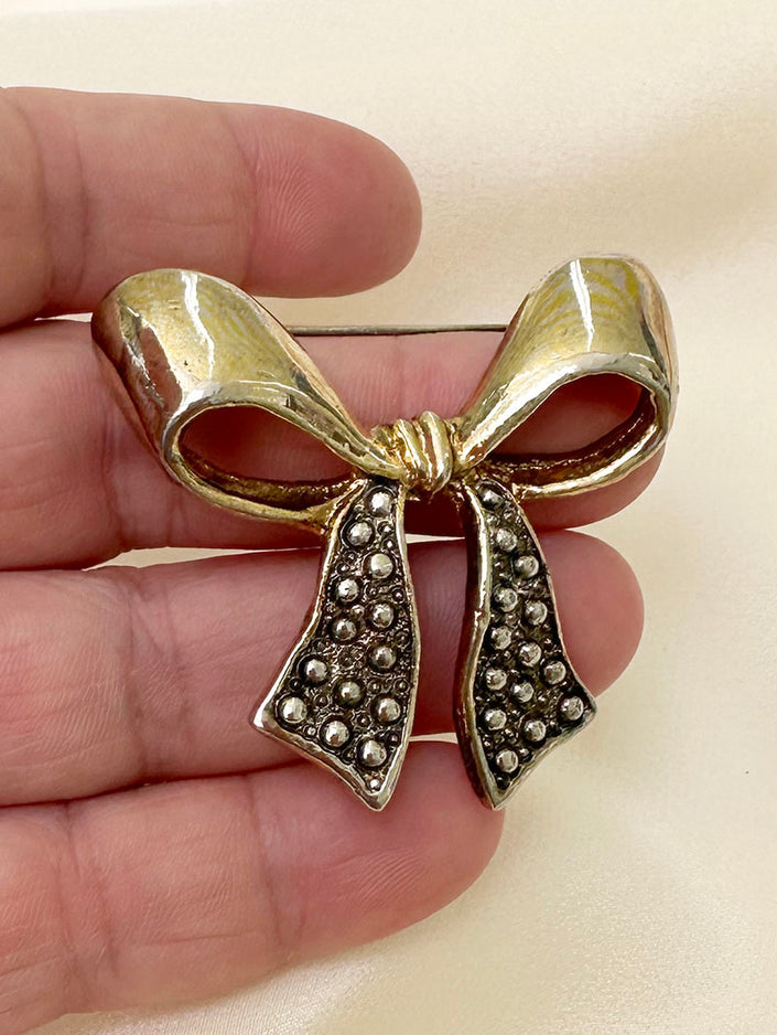 Goud/zilveren strik broche