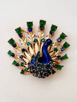 Designer pauw broche