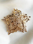 Grote vergulde designer broche
