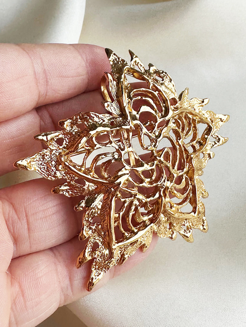 Grote vergulde designer broche